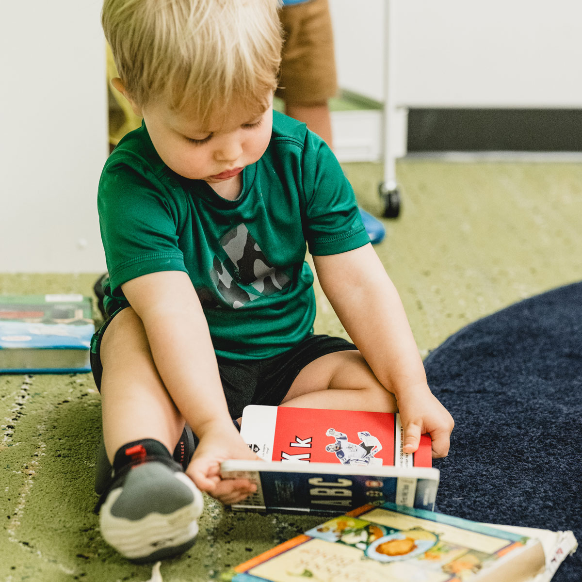 Young child playing with book