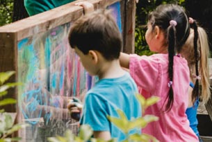 Children painting outdoors
