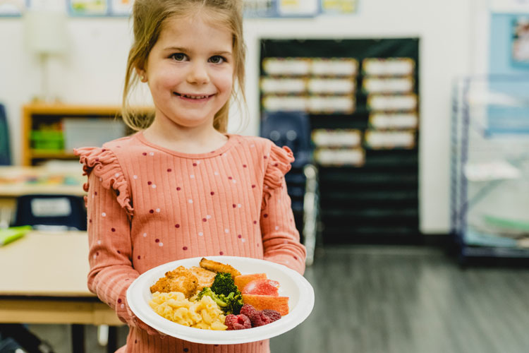 Girl holding nutritious meal